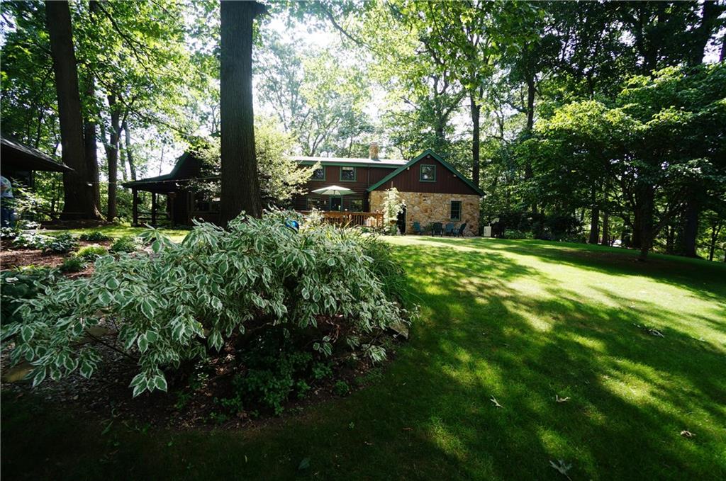 45 Dovercrest Road Eighty Four, PA 15330 - Photo 3 of 25 Large stone patio and deck Magnificent Gardens feels and looks like a vacation home in the mountains