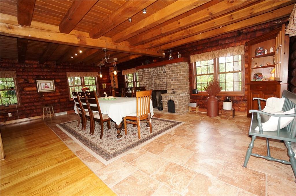 45 Dovercrest Road Eighty Four, PA 15330 - Photo 5 of 25 Ash hardwood flooring, exposed log walls, post and beam construction define this Great Room w its used brick fireplace