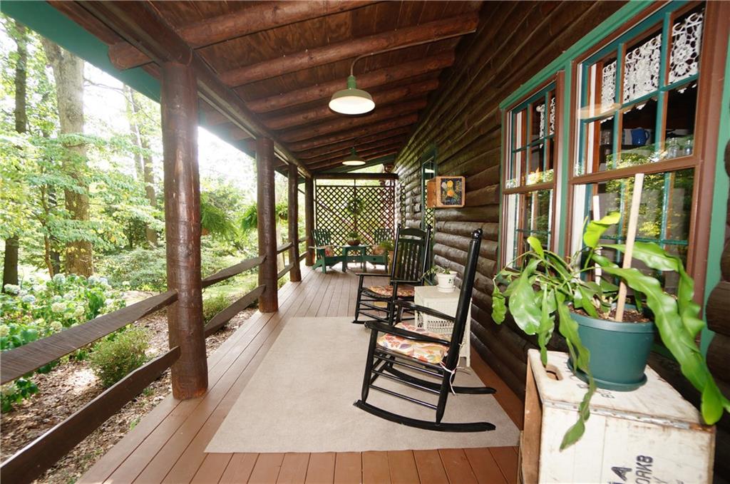 45 Dovercrest Road Eighty Four, PA 15330 - Photo 8 of 25 A cozy side porch runs the whole depth of the home...With a door leading directly in the home or a stone pathway leading to the rear deck or gardens