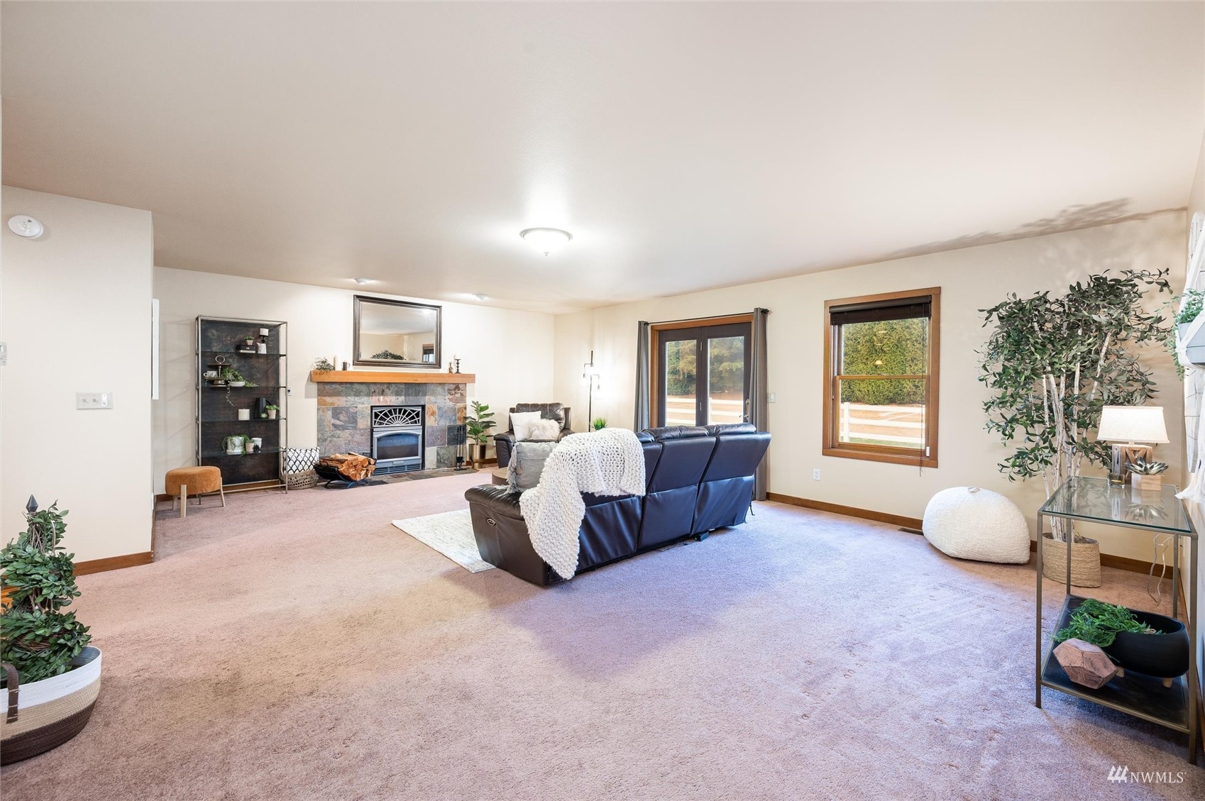 830 East Wiser Lake Road Lynden, WA 98264 - Photo 8 of 40 a living room with furniture a fireplace and a large window