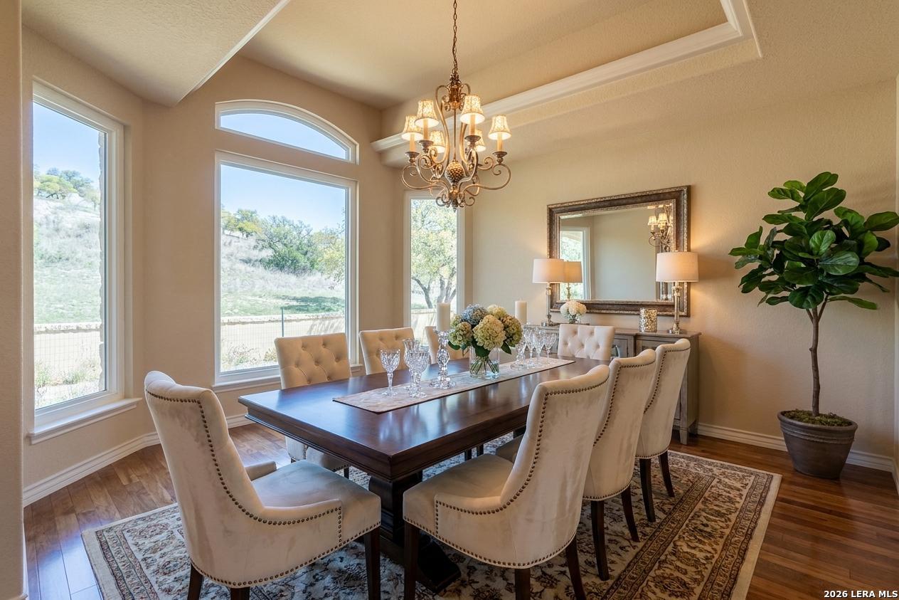 198 Echo Falls Road Comfort, TX 78013 - Photo 9 of 28 a view of a dining room with furniture window and wooden floor