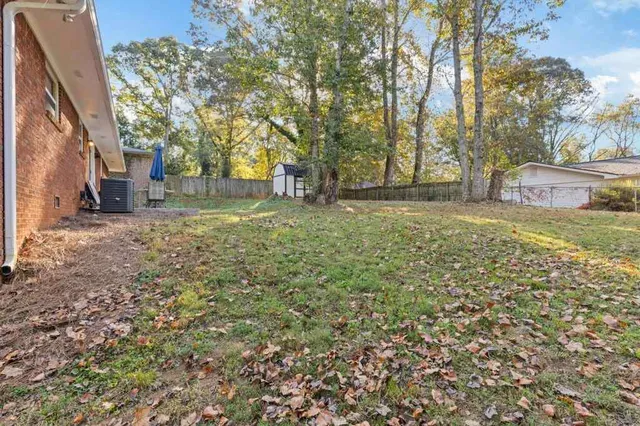 a view of a yard with a tree