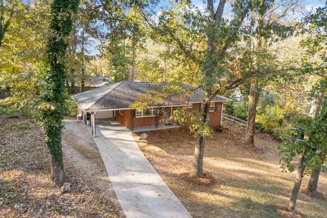 a view of a house with large tree