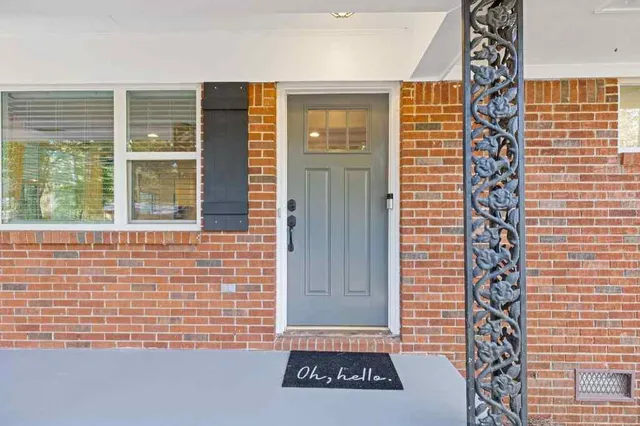 a view of a door and a window