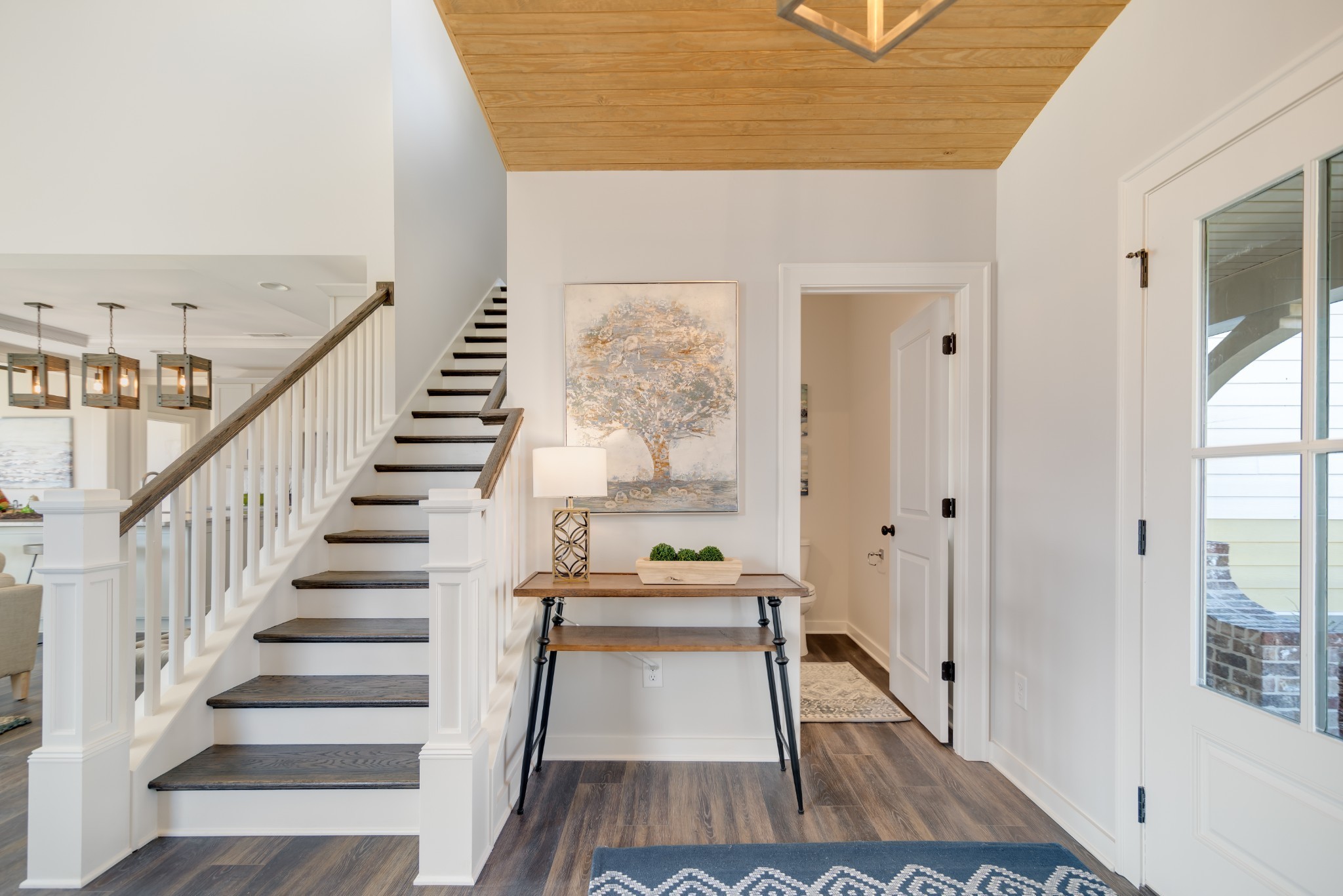 1019 Fallow Road, Unit 812 Mount Juliet, TN 37122 - Photo 6 of 23 a view of a hallway with wooden floor and staircase