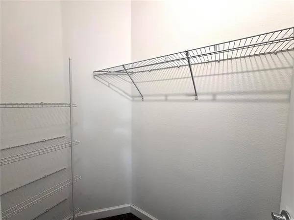 a view of small space with racks on the wall