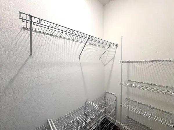 a view of a room with racks on the wall