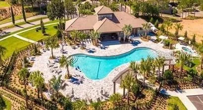 a view of a swimming pool with a yard