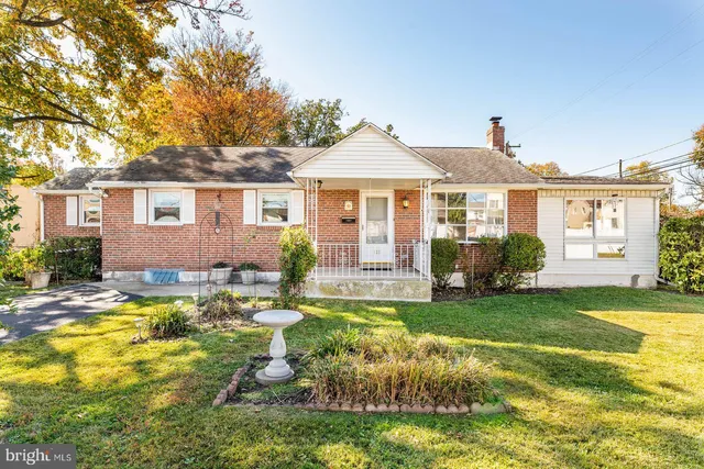a view of a house with swimming pool and porch with furniture