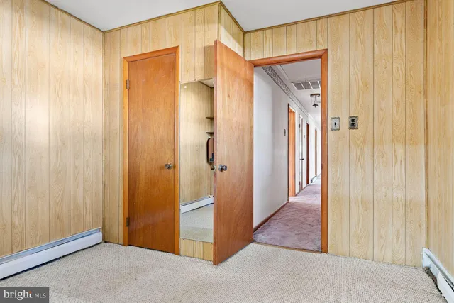 a view of a hallway with closet area