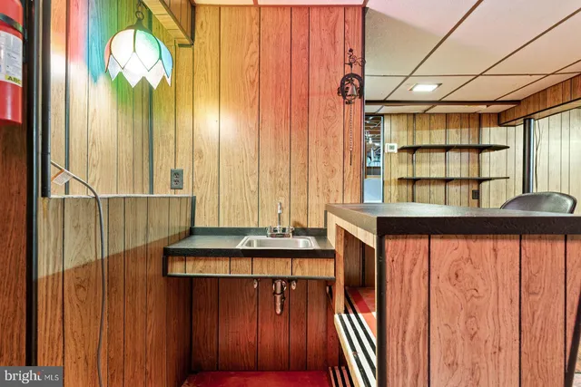 a view of a balcony with furniture and window