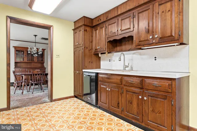 a kitchen with stainless steel appliances granite countertop a refrigerator and cabinets