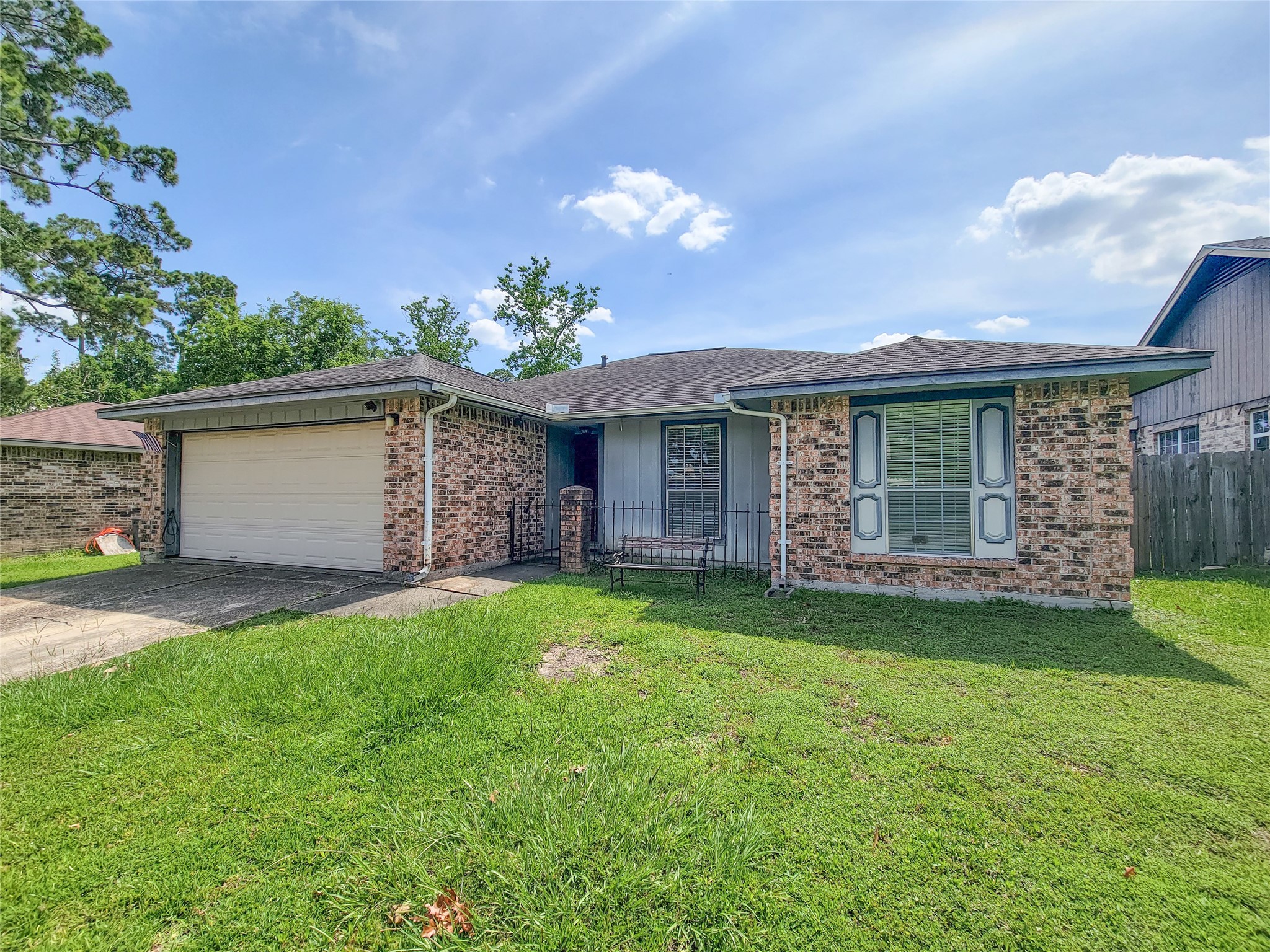 23211 Timberbrook Drive Spring, TX 77373 - Photo 2 of 34 a front view of a house with a garden