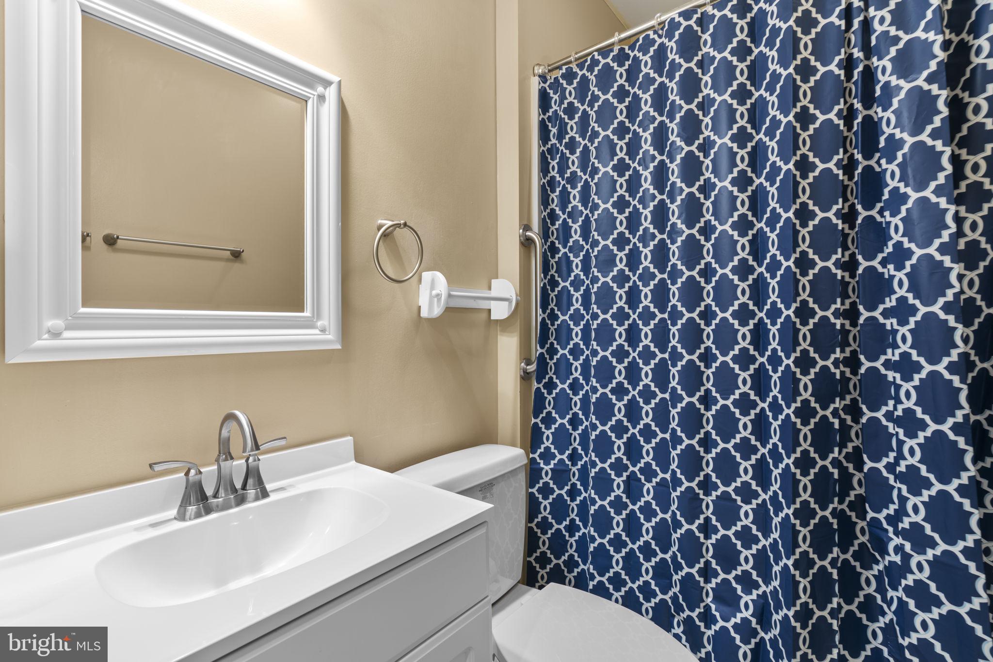 8024 Solley Road Glen Burnie, MD 21060 - Photo 69 of 83 a bathroom with a sink and a mirror