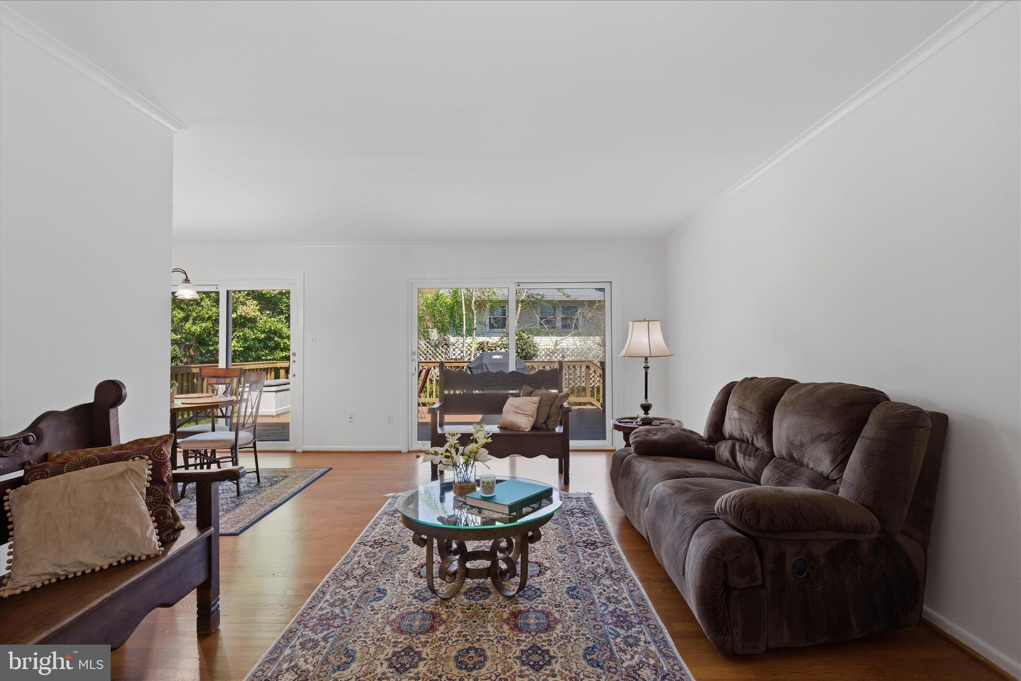 2510 Swift Run Street Vienna, VA 22180 - Photo 19 of 42 a living room with furniture wooden floor and a large window
