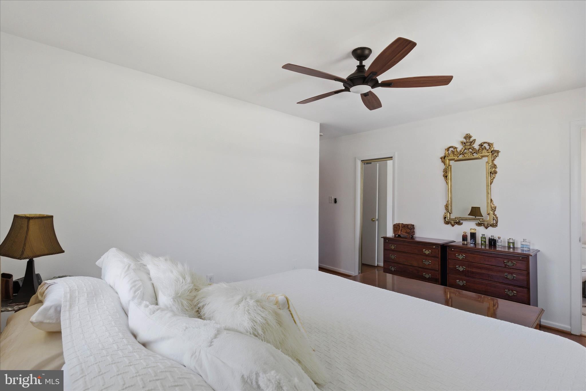 2510 Swift Run Street Vienna, VA 22180 - Photo 24 of 42 a bedroom with a bed and a dresser