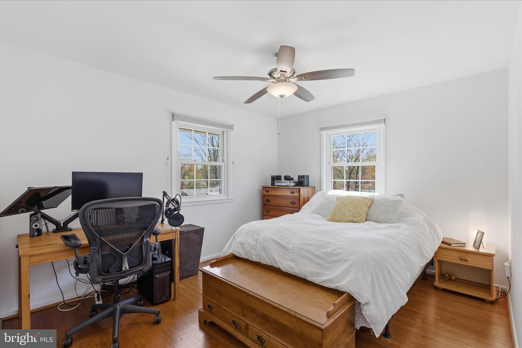 2510 Swift Run Street Vienna, VA 22180 - Photo 27 of 42 a bedroom with a bed and wooden floor
