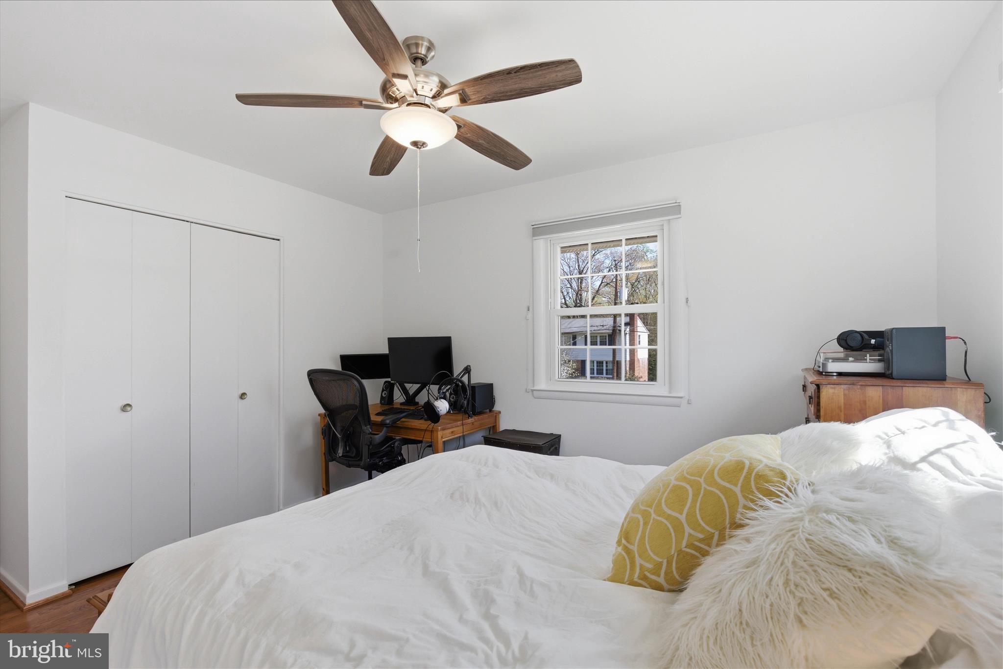 2510 Swift Run Street Vienna, VA 22180 - Photo 28 of 42 a bedroom with a large bed and a tv