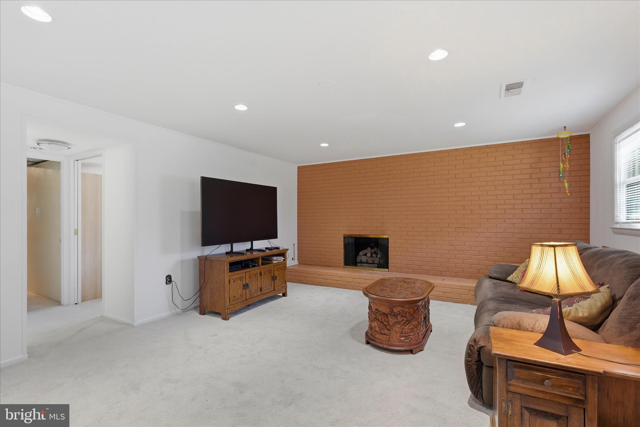 2510 Swift Run Street Vienna, VA 22180 - Photo 30 of 42 a living room with furniture and a flat screen tv