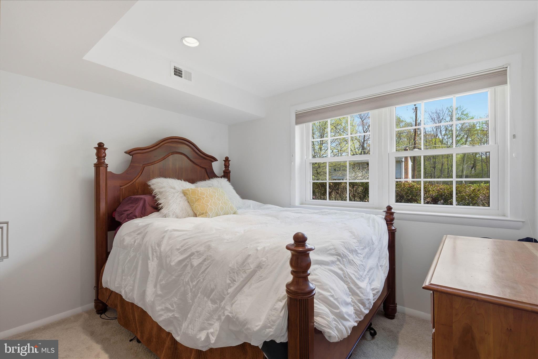 2510 Swift Run Street Vienna, VA 22180 - Photo 32 of 42 a bed sitting in a bedroom next to a window