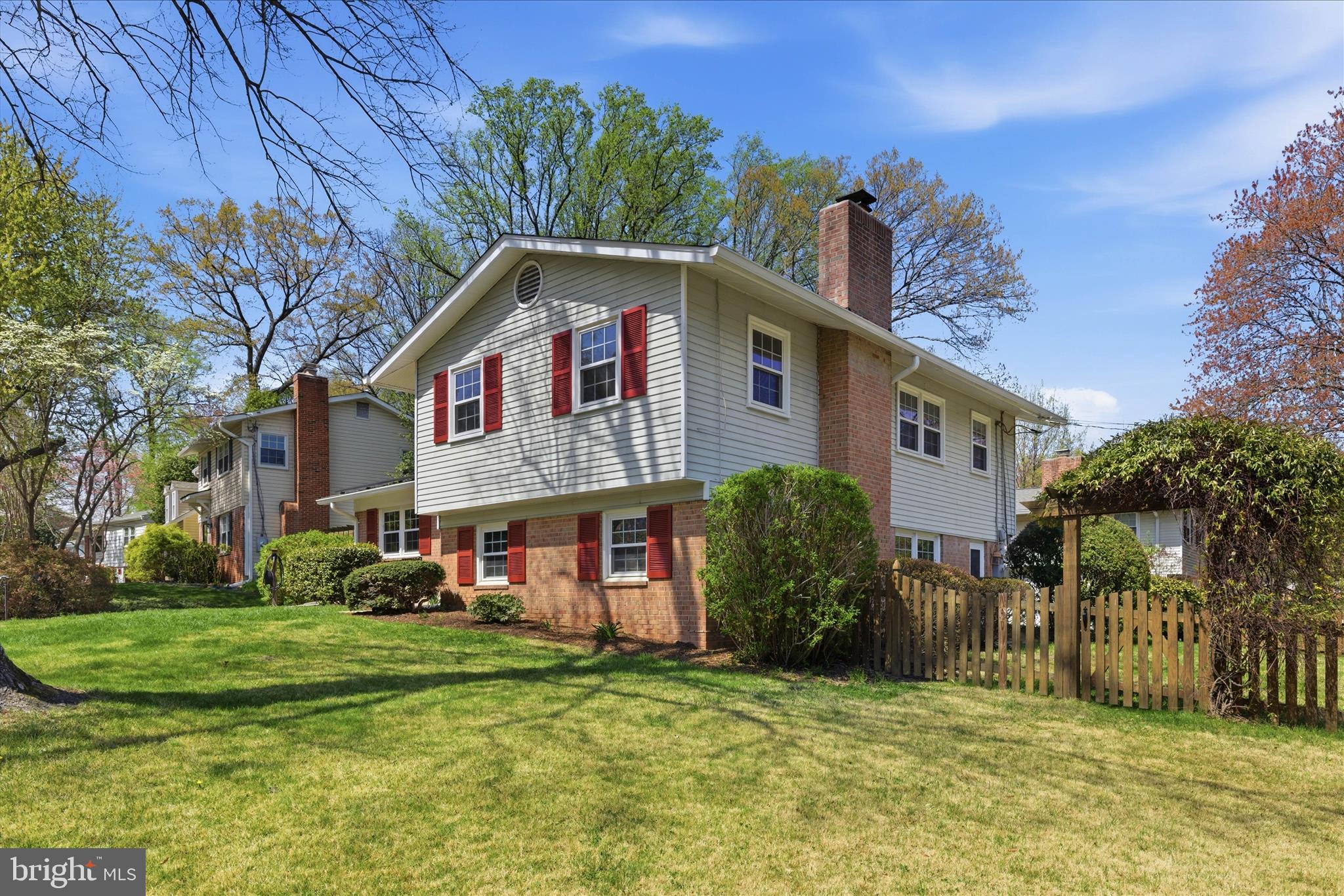 2510 Swift Run Street Vienna, VA 22180 - Photo 5 of 42 a front view of a house with a garden