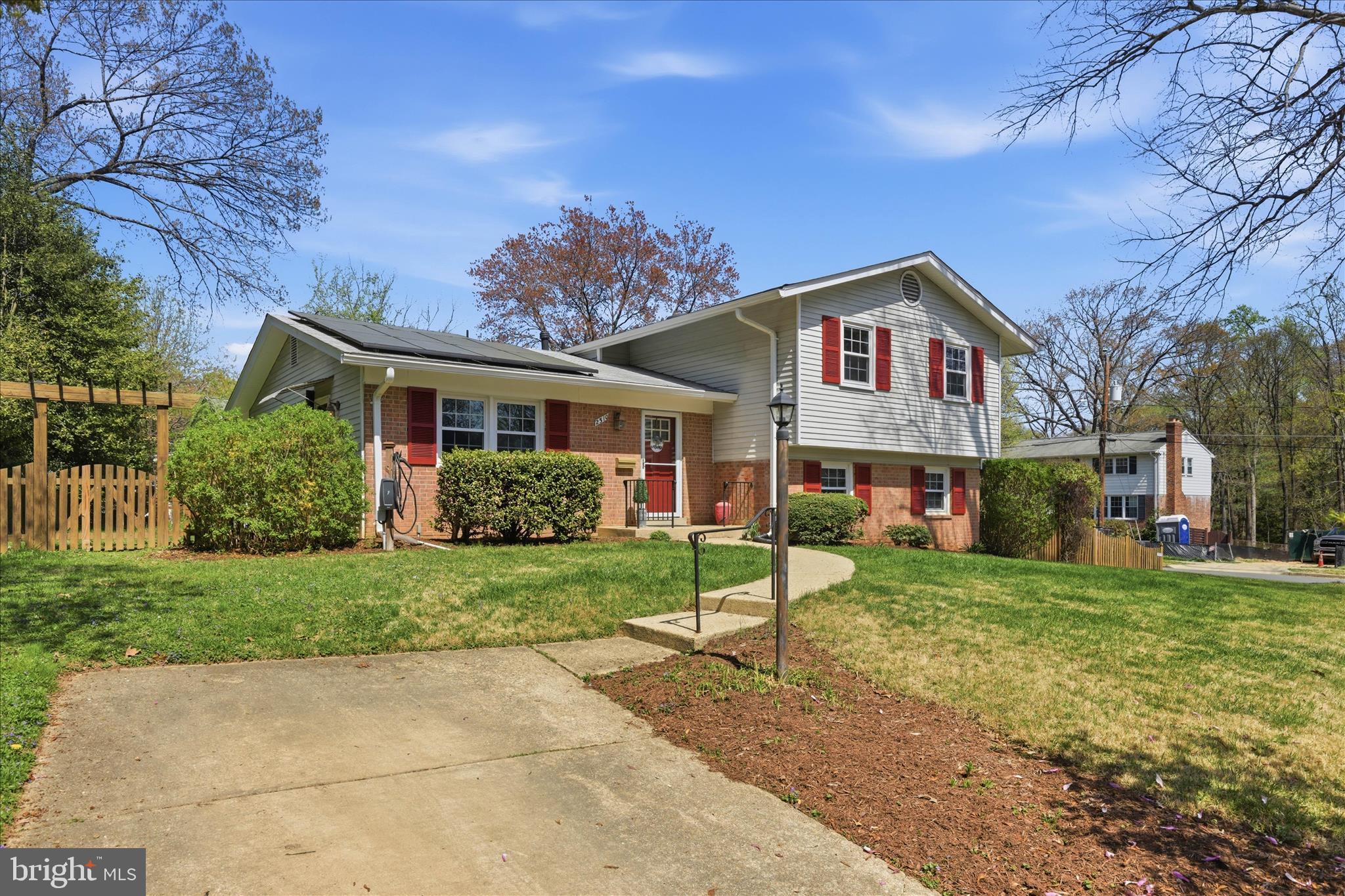2510 Swift Run Street Vienna, VA 22180 - Photo 6 of 42 a front view of a house with a yard