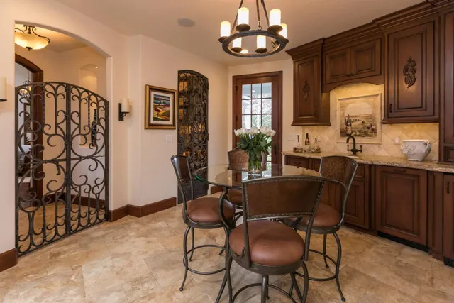 a living room with furniture and a book shelf