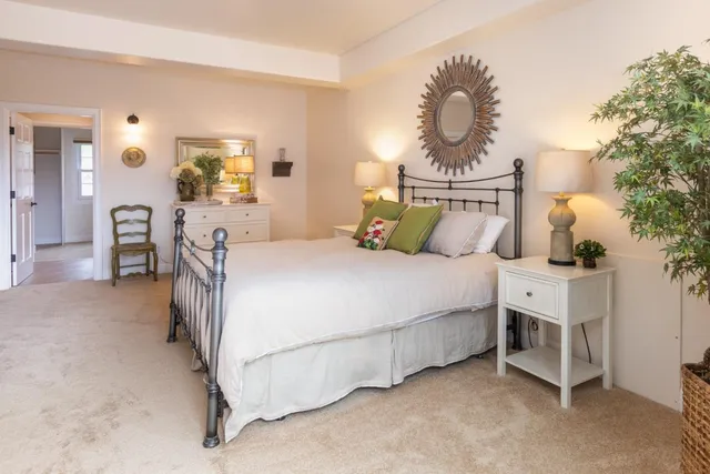 a view of a patio with table and chairs and potted plants