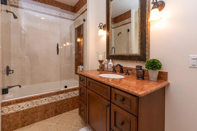 a view of a house with a yard and sitting area