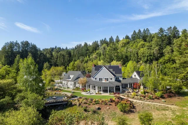 a view of a chairs and table in a backyard