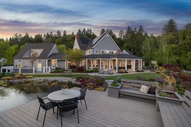 a kitchen with stainless steel appliances granite countertop a sink counter space cabinets and a large window