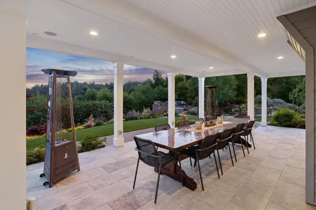 a kitchen with stainless steel appliances kitchen island granite countertop a sink and cabinets