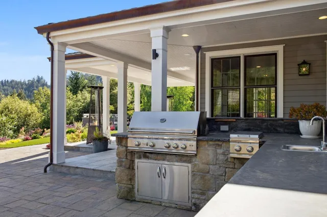 a bathroom with a sink a mirror and a shower