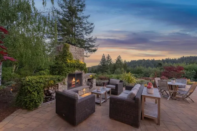 a view of a table and chairs on the roof deck