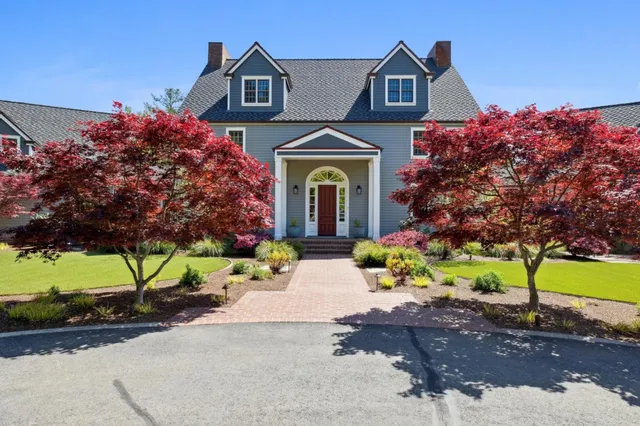 a large kitchen with kitchen island granite countertop lots of counter top space and stainless steel appliances