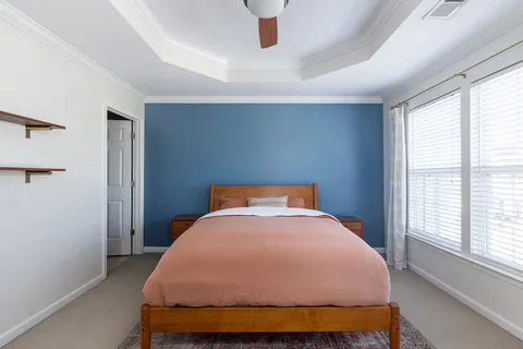 a bedroom with a bed and window