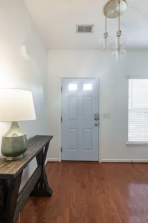 a workspace with furniture and chandelier