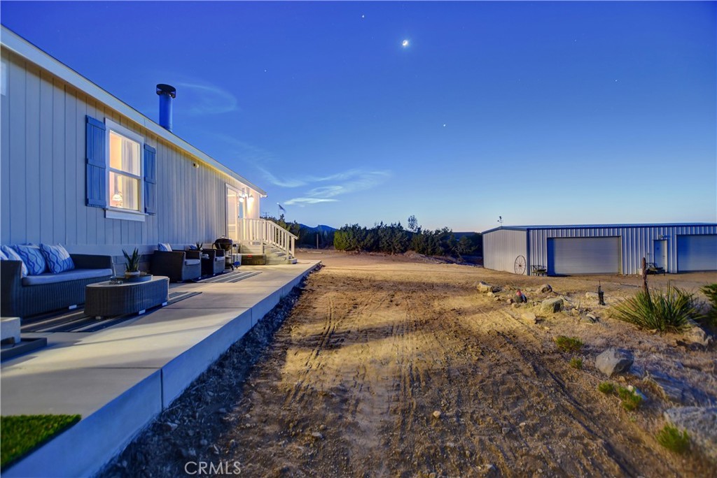 1330 Tamarack Road Pinon Hills, CA 92372 - Photo 16 of 19 a view of a house with a yard