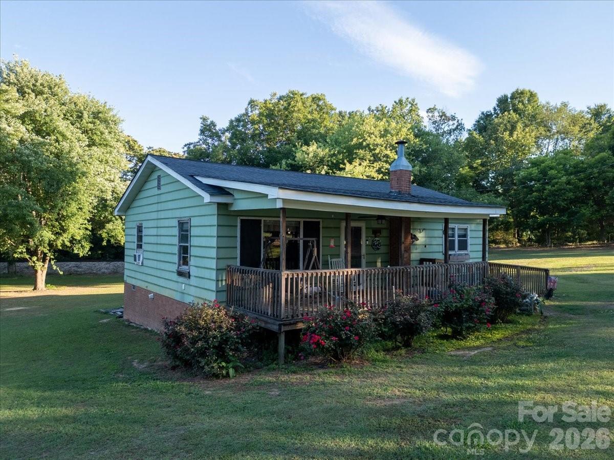12282 Coyle Road Stanfield, NC 28163 - Photo 22 of 24 a front view of a house with garden