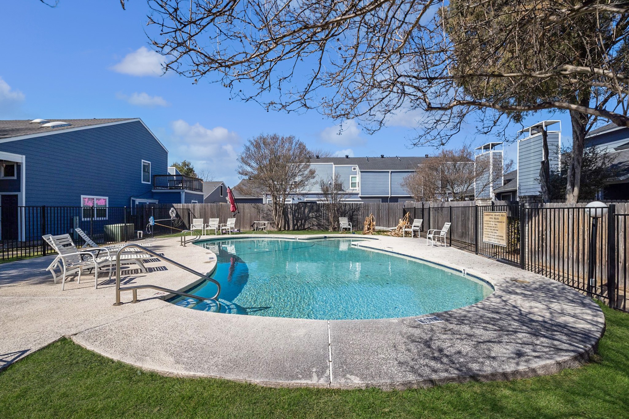 1010 West Rundberg Lane, Unit 30 Austin, TX 78758 - Photo 27 of 30 a view of a house with swimming pool and sitting area
