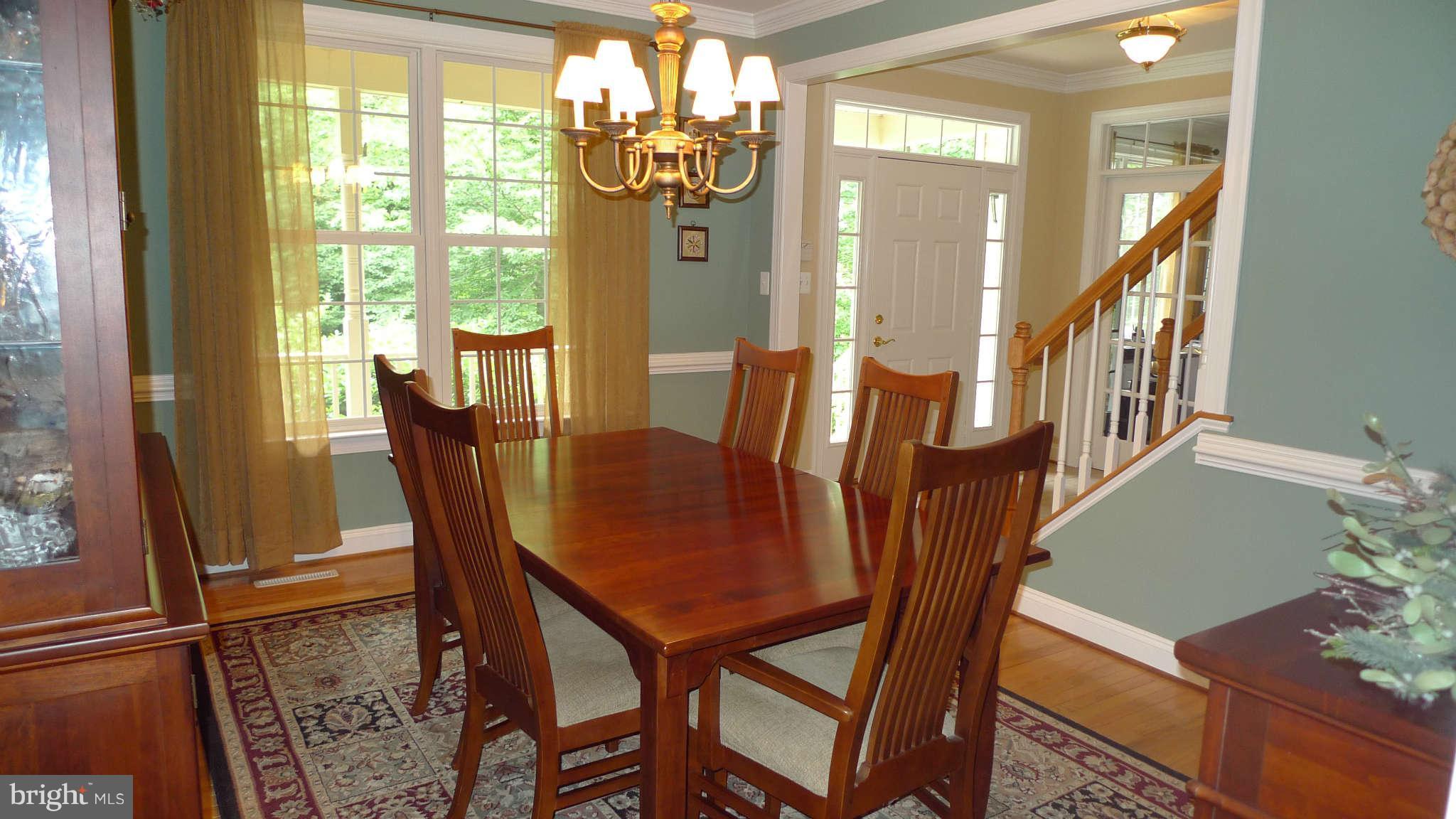 3366 Basford Road Frederick, MD 21703 - Photo 19 of 30 a view of a dining room with furniture window and wooden floor