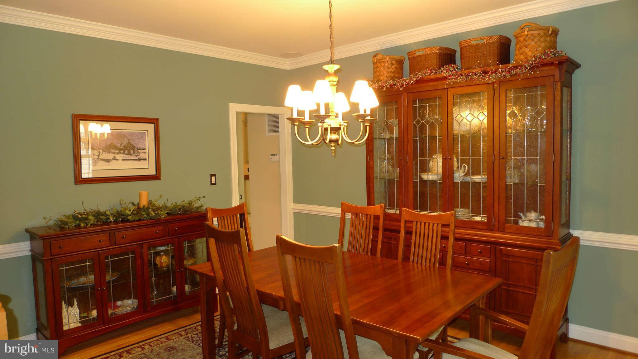 3366 Basford Road Frederick, MD 21703 - Photo 20 of 30 a dining room with furniture and chandelier kitchen view
