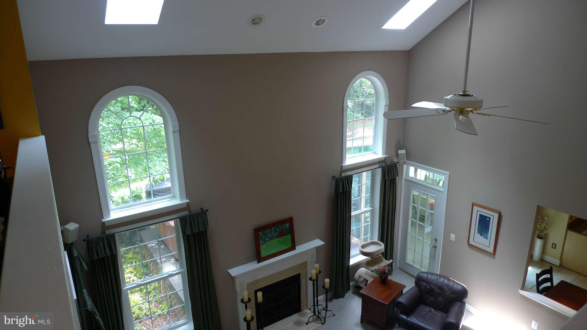 3366 Basford Road Frederick, MD 21703 - Photo 24 of 30 a view of a livingroom with furniture window wooden floor and a fireplace
