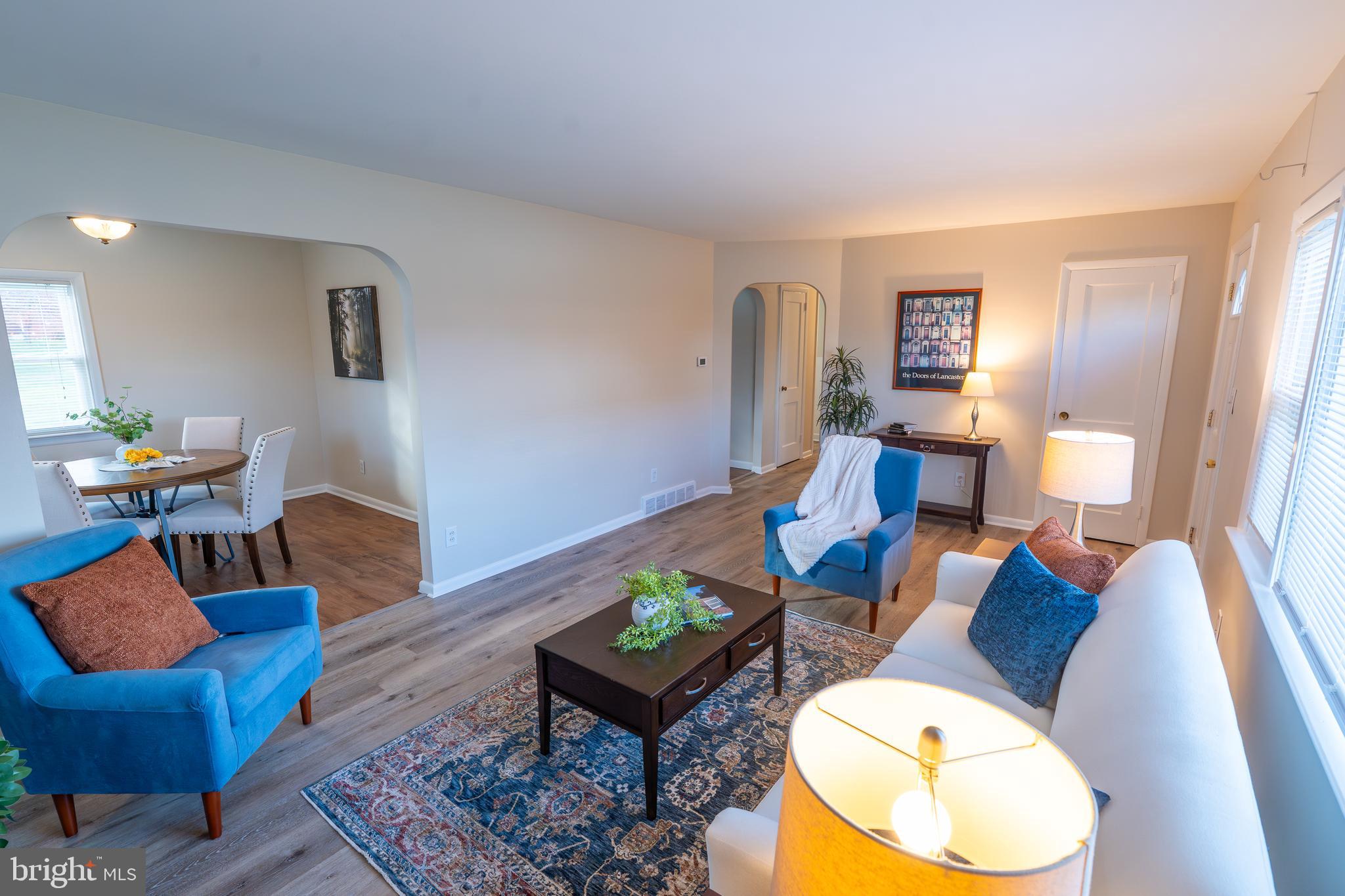 1110 Rohrerstown Road Lancaster, PA 17601 - Photo 12 of 35 a living room with furniture and a lamp