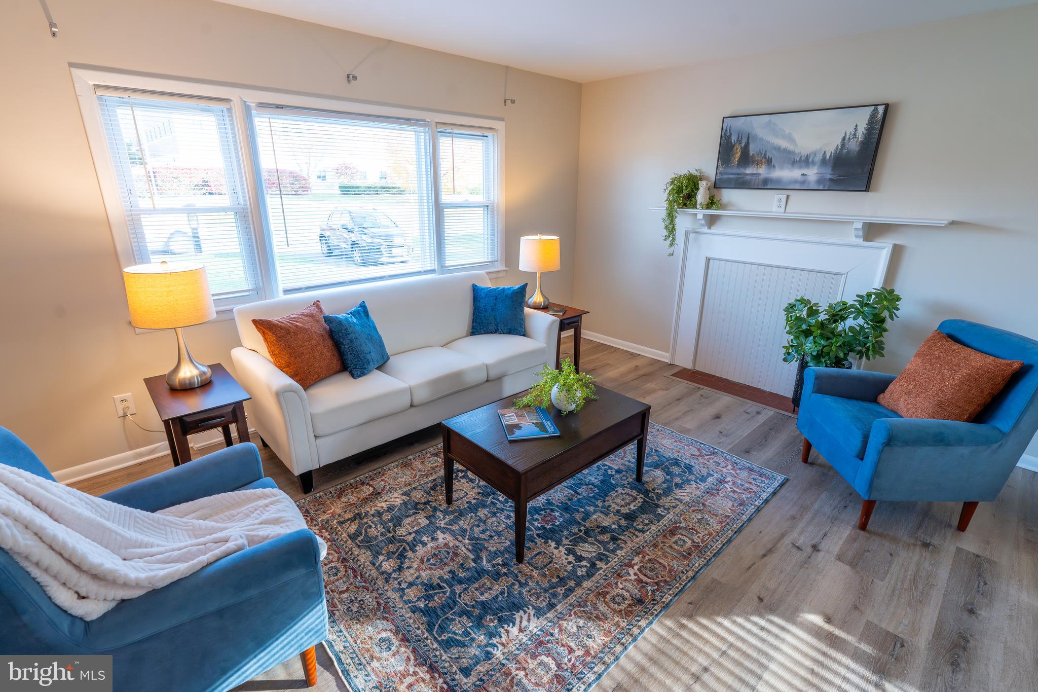 1110 Rohrerstown Road Lancaster, PA 17601 - Photo 13 of 35 a living room with furniture and a potted plant