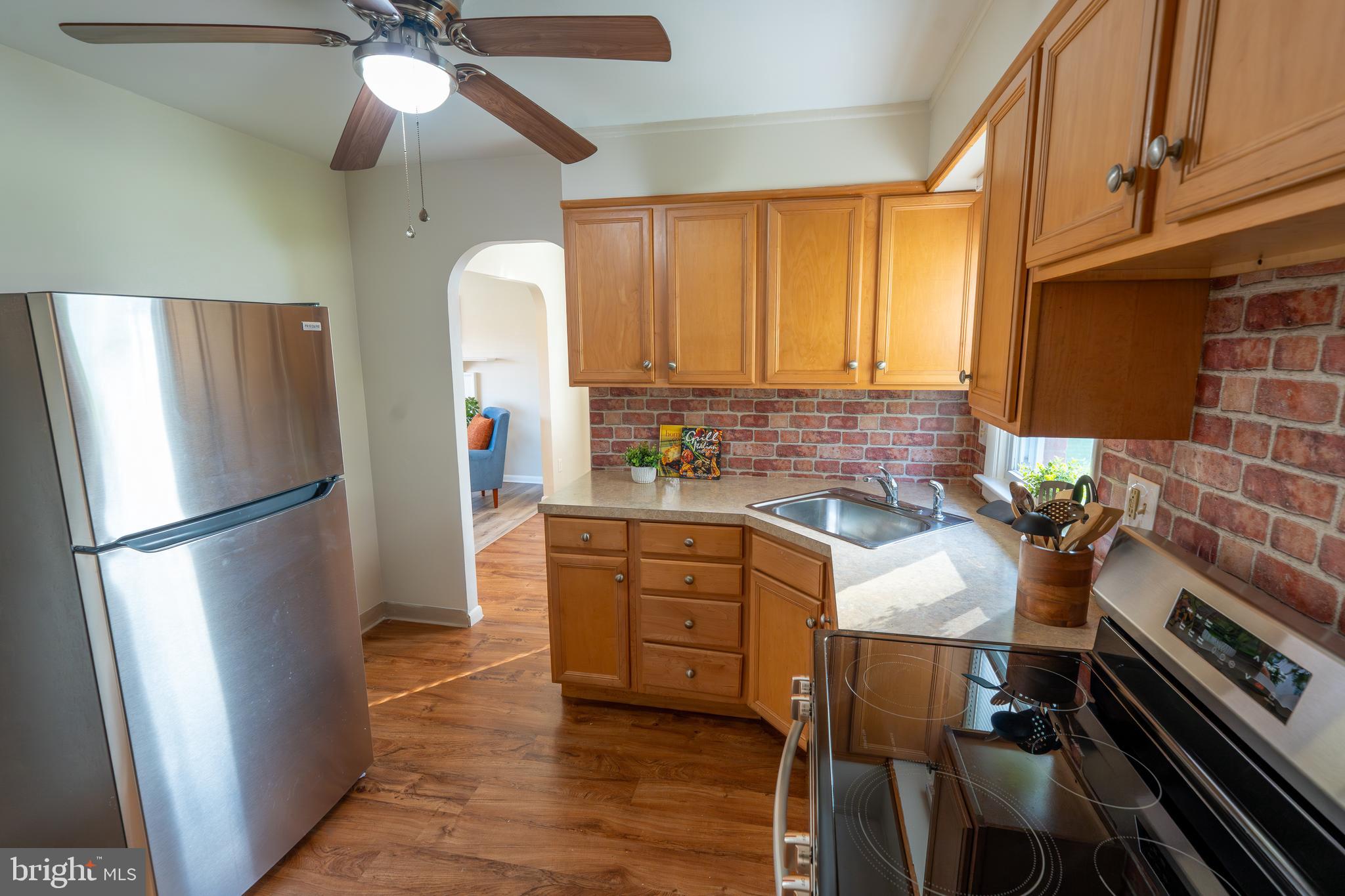 1110 Rohrerstown Road Lancaster, PA 17601 - Photo 18 of 35 a kitchen with stainless steel appliances a stove a refrigerator and a microwave