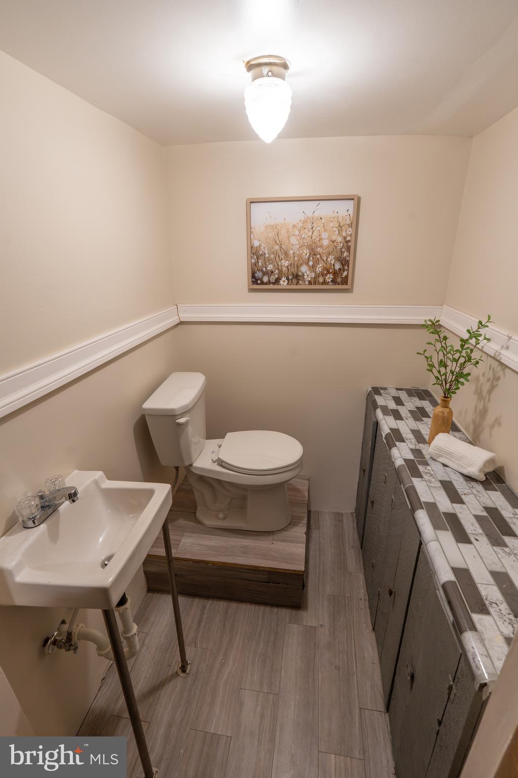 1110 Rohrerstown Road Lancaster, PA 17601 - Photo 31 of 35 a bathroom with a sink mirror and toilet