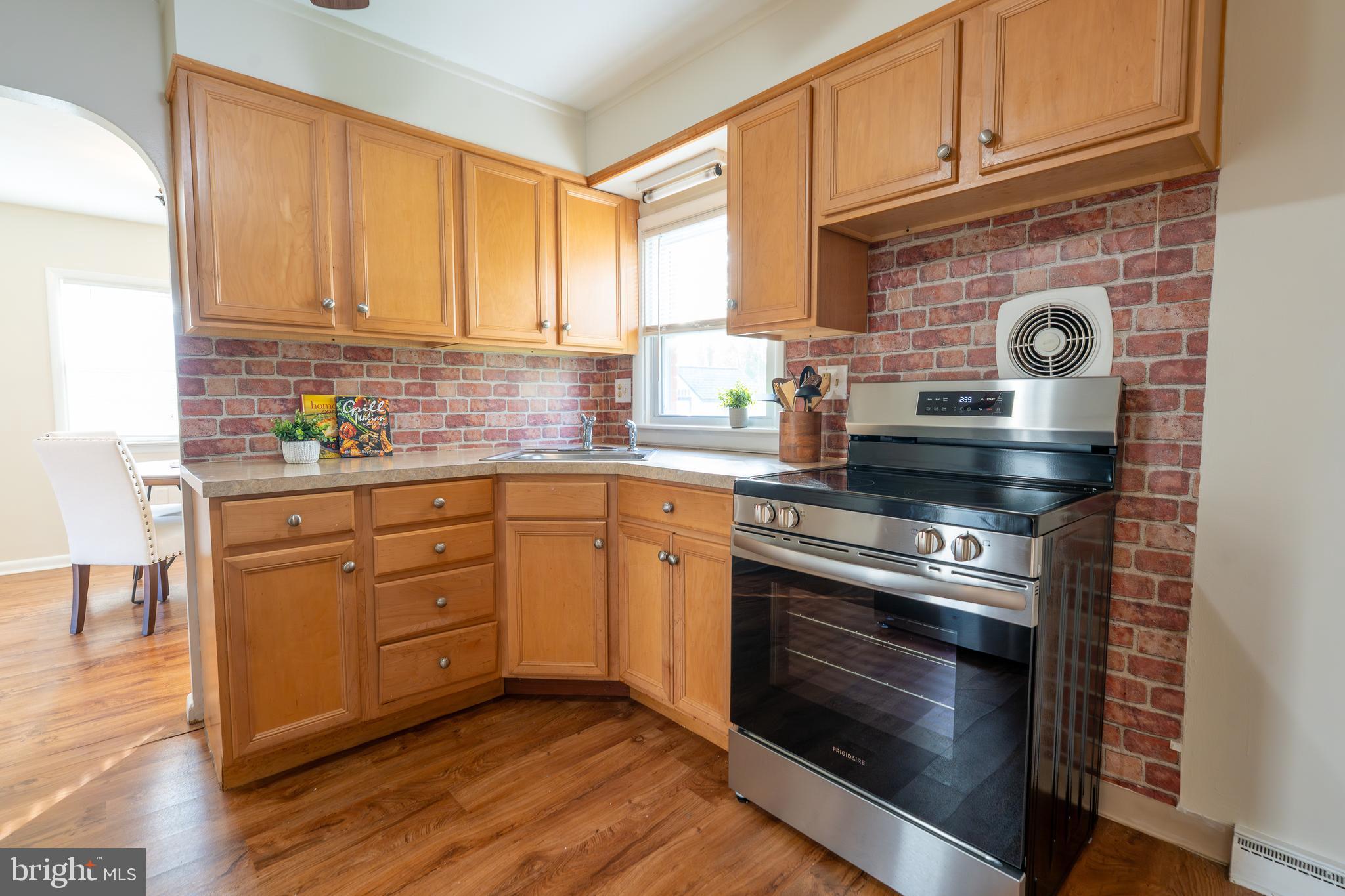 1110 Rohrerstown Road Lancaster, PA 17601 - Photo 4 of 35 a kitchen with a stove oven and sink