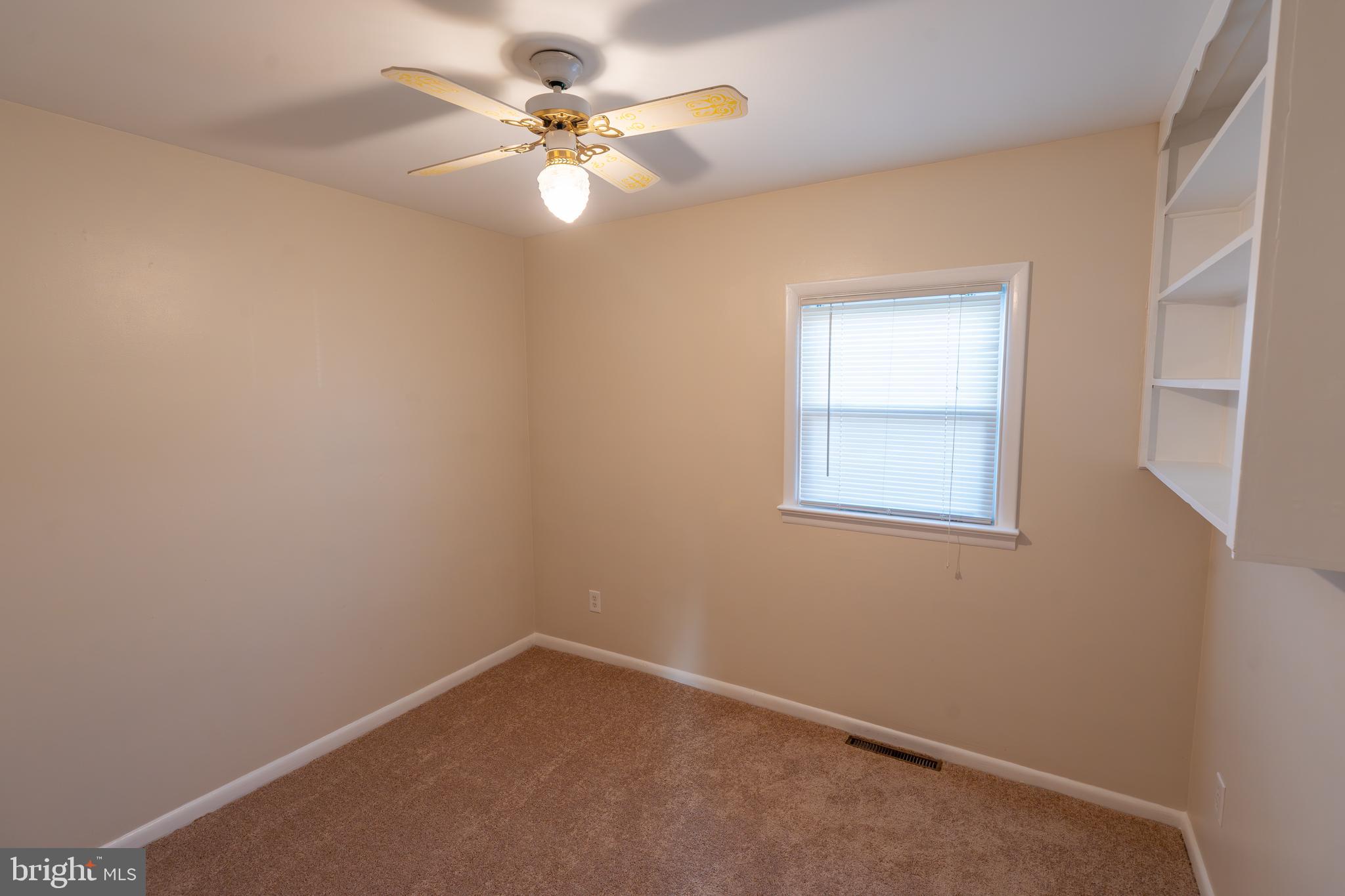 1110 Rohrerstown Road Lancaster, PA 17601 - Photo 6 of 35 an empty room with a window and a fan