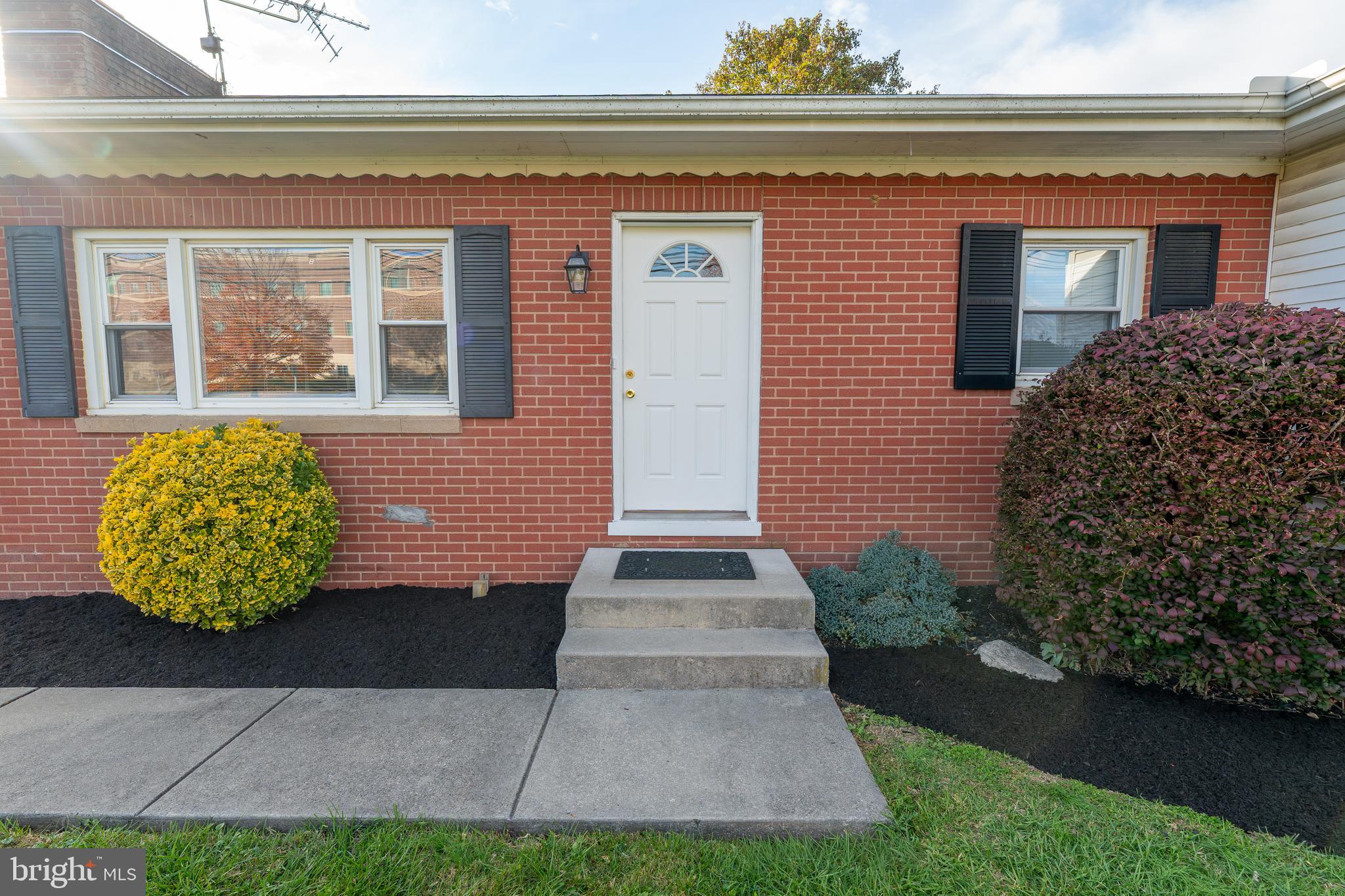 1110 Rohrerstown Road Lancaster, PA 17601 - Photo 9 of 35 a front view of a house with garden